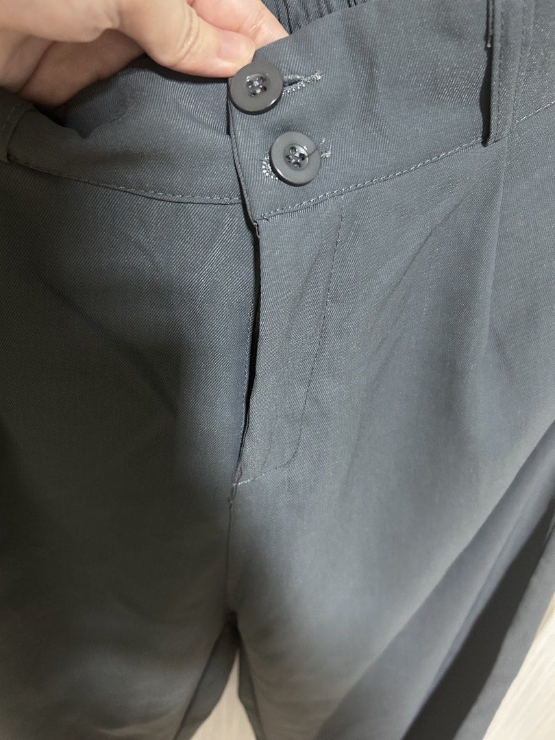 High Waisted Wide Leg Trousers Grey (Category: Other Bottoms) located in Manila. Submitted by juvy13 (Listing ID 1463016618, Image 2). Description: - Grey wide leg trousers - High-waisted fit - Button and zip closure - Elasticated back waistband for comfort - Pleated front detail - Perfect for dressing up or down - Ideal for work or casual occasions.