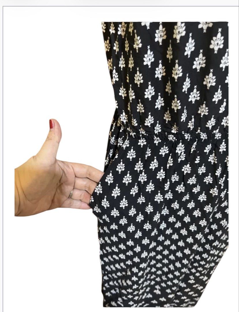 H&M black and White FlowyPatterned Jumpsuit with Pockets (Category: Jumpsuits) located in Quezon City. Submitted by letsdeclutter101 (Listing ID 1463090202, Image 3). Description: - Adorable black and white all-over pattern jumpsuit - Features delicate spaghetti straps - Flattering cinched waist design - Convenient side pockets - Versatile for casual outings or dressing up - Comfortable and easy to wear.