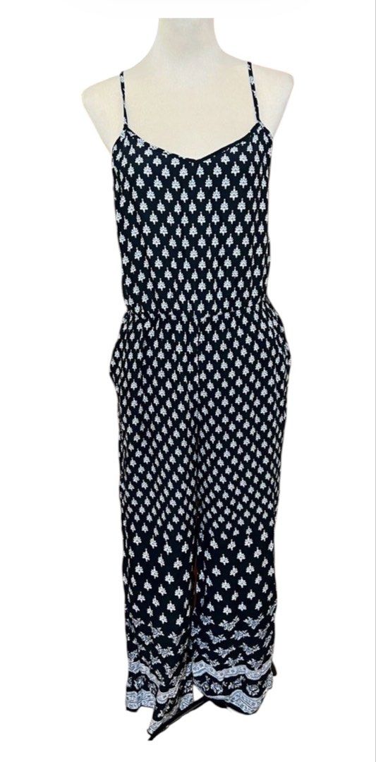H&M black and White FlowyPatterned Jumpsuit with Pockets (Category: Jumpsuits) located in Quezon City. Submitted by letsdeclutter101 (Listing ID 1463090202, Image 2). Description: - Adorable black and white all-over pattern jumpsuit - Features delicate spaghetti straps - Flattering cinched waist design - Convenient side pockets - Versatile for casual outings or dressing up - Comfortable and easy to wear.