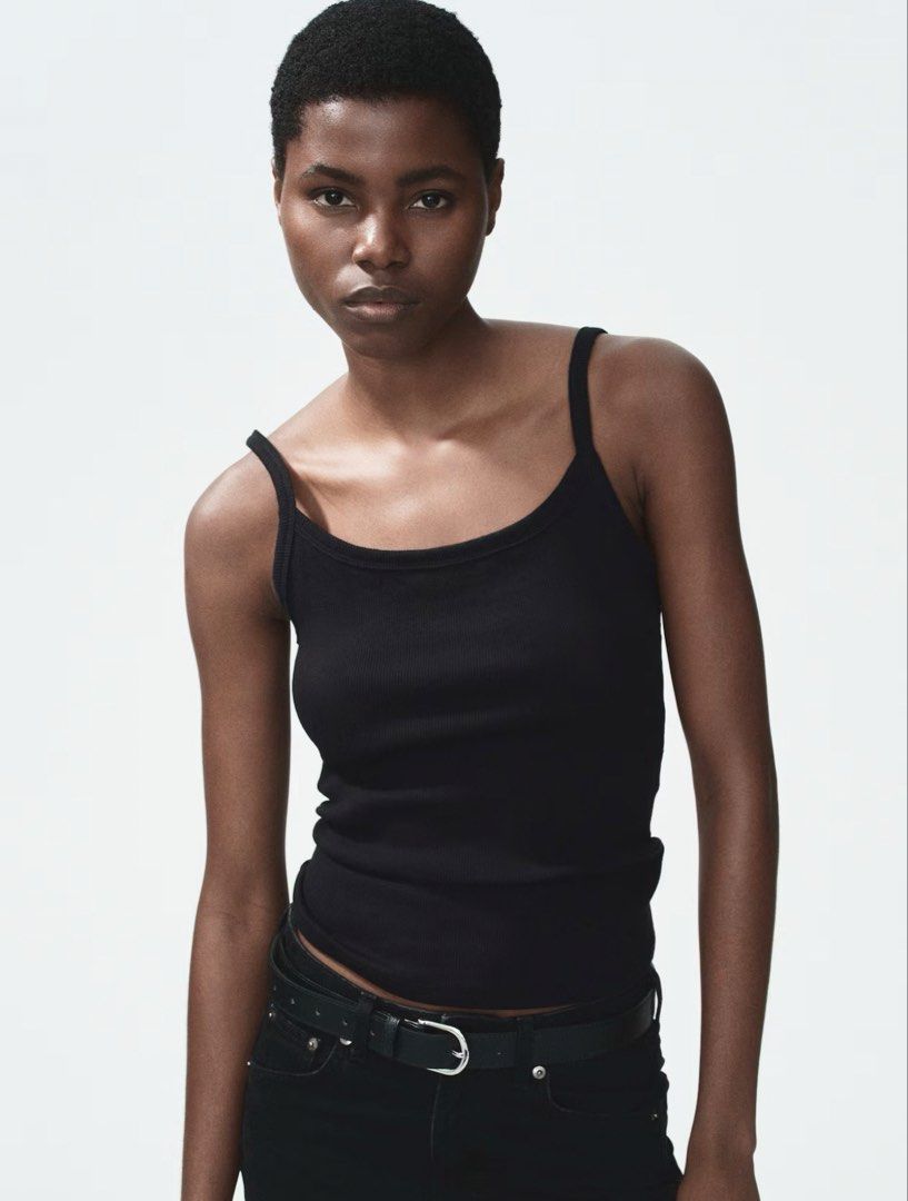 H&M Black Ribbed Cotton Tank Top (Category: Sleeveless) located in Manila. Submitted by chicdistrict.ph (Listing ID 1462972259, Image 1). Description: - Basic black ribbed tank top - Thin spaghetti straps - Simple and versatile - Great for layering or wearing on its own - Stretchy material for a comfortable fit - Looks good with jeans or skirts.