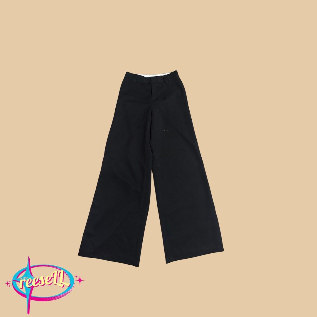 H&M Black Wide Leg Trousers (Category: Other Bottoms) located in Iloilo. Submitted by reesespuffs_ (Listing ID 1463029499, Image 2). Description: - Black wide leg trousers - High-waisted with button and zip closure - Two front pockets - Fabric with a nice drape - Versatile for dressing up or down - Comfortable fit.