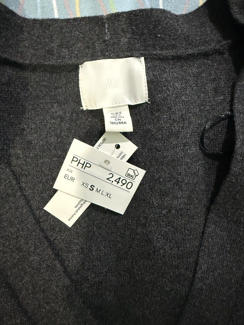 H&M Dark Grey V-Neck Button-Up Cardigan (Category: Coats, Jackets and Outerwear) located in Quezon City. Submitted by francfgr (Listing ID 1463053315, Image 2). Description: - Brand: H&M - Color: Dark Grey - Style: V-neck cardigan - Features: Button-up front, long sleeves - Condition: Brand new with original tag attached - Original Price: PHP 2,490.