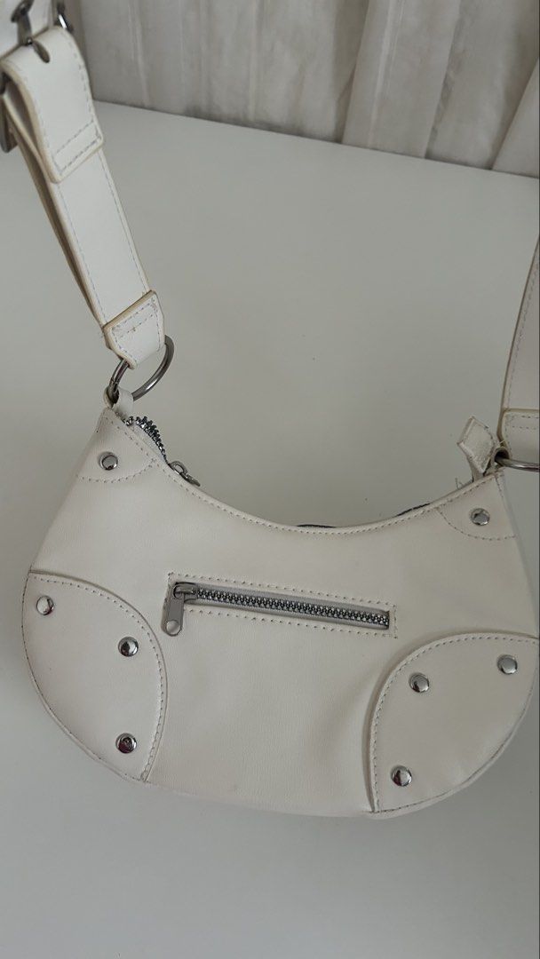 H&M White Shoulder Bag with Silver Studs (Category: Shoulder Bags) located in Cavite. Submitted by yamyam. (Listing ID 1462915062, Image 1). Description: - Cute white shoulder bag - Front zip pocket for easy access - Stylish silver stud details all around - Adjustable strap for comfortable wear - Ideal for everyday use - Fits all your essentials.