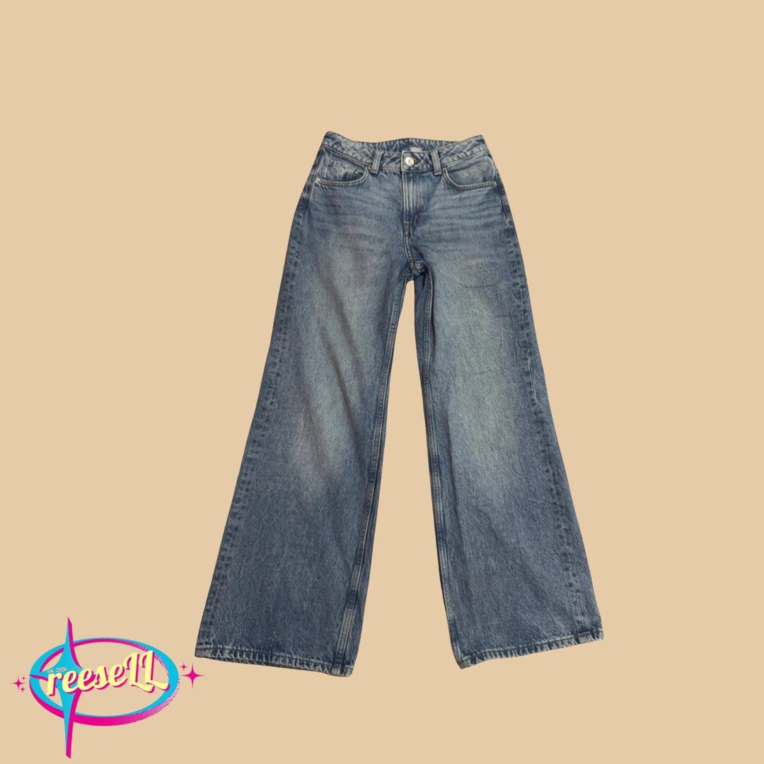 H&M Wide Leg Jeans (Category: Jeans) located in Iloilo. Submitted by reesespuffs_ (Listing ID 1463029395, Image 2). Description: - Classic blue wash jeans - High-waisted fit - Wide leg opening - Super comfy and stylish - Versatile for dressing up or down - Easy to pair with any top.