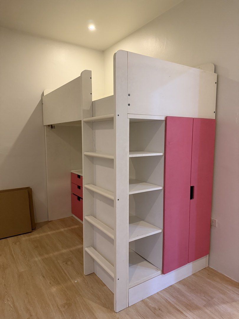Ikea Loft Bed (Category: Bed Frames & Mattresses) located in Cainta. Submitted by itskathleen (Listing ID 1462998149, Image 1). Description: - Loft bed with integrated desk, shelves, and wardrobe - White frame with pink drawer fronts and wardrobe doors - Ideal space-saving solution for a child's room - Ladder included for easy access to the top bunk - Ample storage for clothes and books.