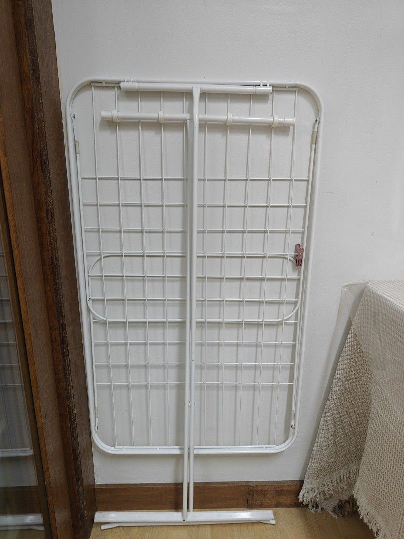 Ikea Mulig White Metal Foldable Drying Rack (Category: Clothes Drying Rack) located in Pasay City. Submitted by stuffz.ph (Listing ID 1463008668, Image 1). Description: - White metal drying rack - Folds flat for easy storage - Multiple bars for hanging clothes - Sturdy construction - Ideal for laundry or airing out items - Perfect for small spaces.