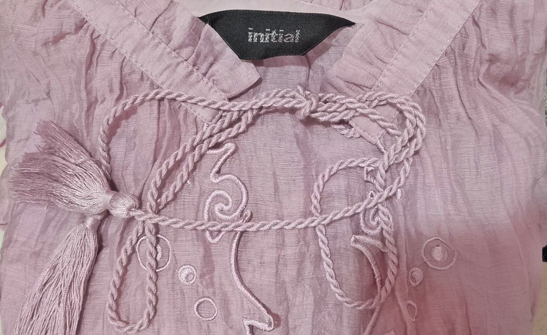 Initial lilac bohemian crinkle blouse (Category: Blouses) located in Cabanatuan. Submitted by miss.maia (Listing ID 1463042371, Image 3). Description: The Initial lilac bohemian crinkle blouse is a signature style from the contemporary fashion brand INITIAL. Known for its fusion of vintage-inspired cuts and avant-garde, relaxed aesthetics, this piece beautifully exemplifies the brand's function-oriented yet romantic approach to womenswear..