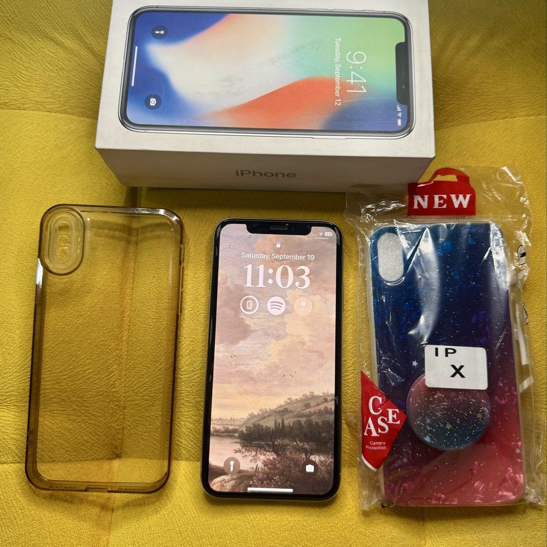 Iphone X 256gb (Category: iPhone X Series) located in Manila. Submitted by rnc.shop (Listing ID 1462952206, Image 3). Description: FOR SALE: iPhone X Silver 256GB Transaction: Meetup Manila location Specs: Silver color, 256GB storage, BH: 100% (battery replaced) Condition: Lady owned, smooth performance, no functional issues, Face ID & TrueTone working, minimal scratches on sides as seen in photos, the cracks are just the screen protector Inclusi