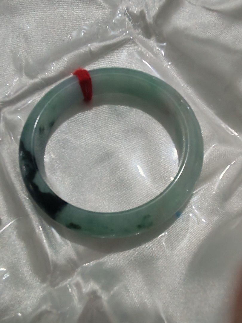 Jadeite Bangle (Category: Bracelets) located in Bacoor. Submitted by jadeitemaster (Listing ID 1463066543, Image 1). Description: This is only one Apple green with flower Well polished. Cheaper price because have stone lines, no crack! Semi icy. Smooth surface, no skin. Size: 55.9 or 56 No discount this item is intended for Japan sale, so only available for a limited time!.
