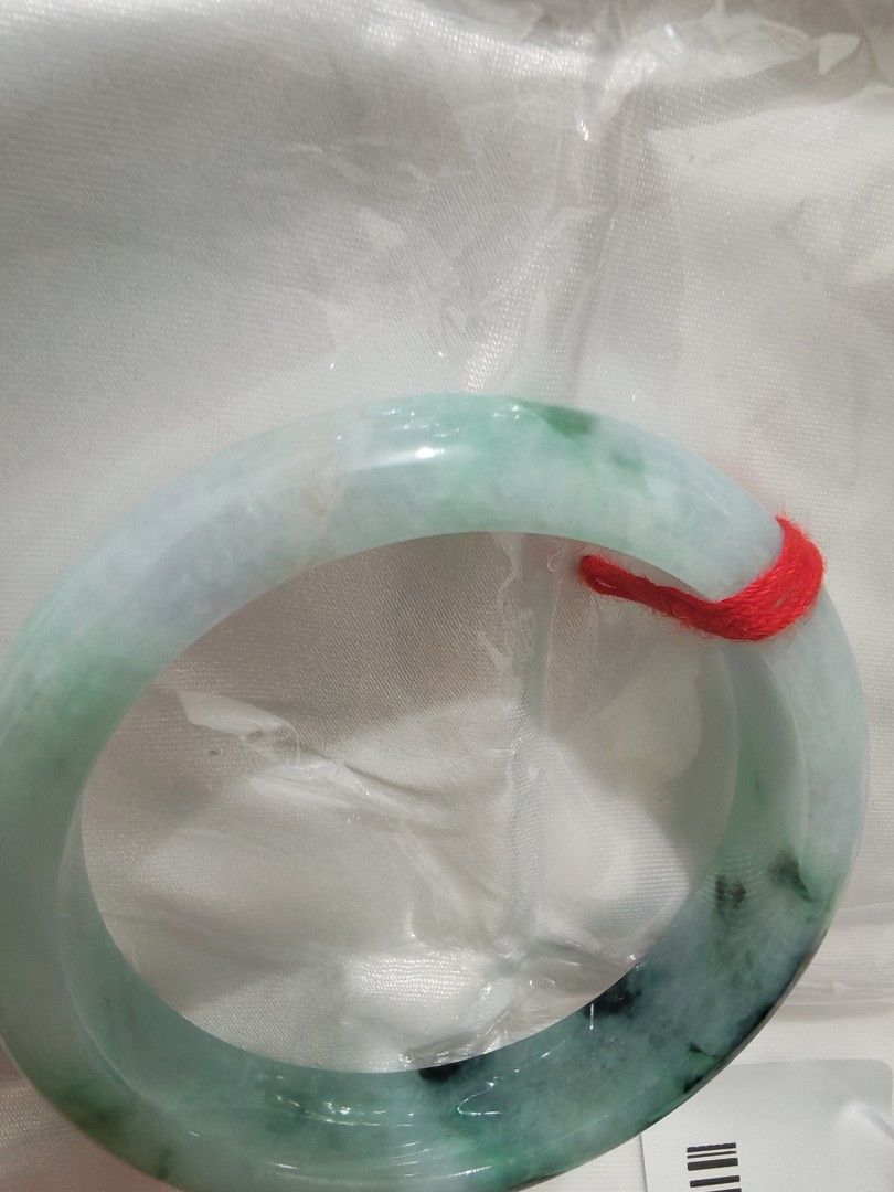 Jadeite Bangle (Category: Bracelets) located in Bacoor. Submitted by jadeitemaster (Listing ID 1463066543, Image 2). Description: This is only one Apple green with flower Well polished. Cheaper price because have stone lines, no crack! Semi icy. Smooth surface, no skin. Size: 55.9 or 56 No discount this item is intended for Japan sale, so only available for a limited time!.