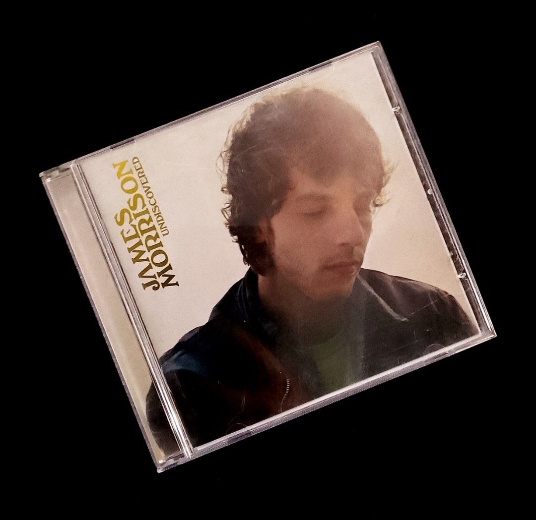 James Morrison - Undiscovered (2006) (Category: CDs & DVDs) located in Manila. Submitted by musicsectionph (Listing ID 1463063965, Image 1). Description: FOR SALE: James Morrison's soulful 2006 acoustic pop/soul masterpiece "Undiscovered" flagship release!‎‎ ABOUT THIS ALBUM: This is the legendary British singer-songwriter's massive debut studio triumph, produced by Martin Terefe and Eg White. It features a brilliant display of raspy, emotive voc