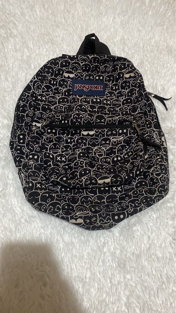 Jansport Backpack - Black with White Cartoon Print (Category: Backpacks) located in Zamboanga. Submitted by trippsnthrifts (Listing ID 1462951904, Image 1). Description: - Classic Jansport backpack - Black with all-over white cartoon print - Front zip pocket - Main compartment - Adjustable straps - Ideal for school or everyday use - Durable material.