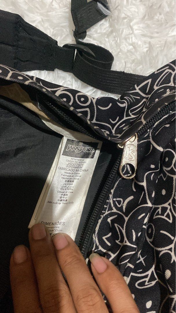 Jansport Backpack - Black with White Cartoon Print (Category: Backpacks) located in Zamboanga. Submitted by trippsnthrifts (Listing ID 1462951904, Image 2). Description: - Classic Jansport backpack - Black with all-over white cartoon print - Front zip pocket - Main compartment - Adjustable straps - Ideal for school or everyday use - Durable material.
