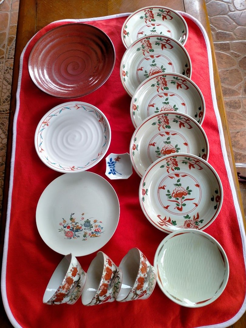 Japanese Ceramic Dinnerware Set - Plates, Bowls, and Serving Dish (Category: Dinnerware & Cutlery) located in Manila. Submitted by margeventa (Listing ID 1462905531, Image 3). Description: - Authentic Japanese ceramic dinnerware set - Includes multiple plates in various sizes and designs - Several small bowls included - Large serving dish with a striking red swirl pattern - Features elegant floral motifs and simple textured designs - Ideal for ev
