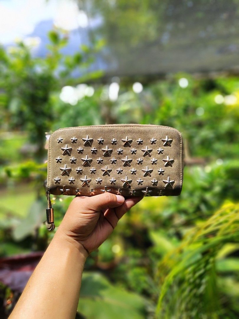 Jimmy Choo (Category: Luxury Bags & Wallets) located in Bacolod City. Submitted by johnthrift (Listing ID 1462927257, Image 2). Description: Jimmy Choo Bagsak Sale Authentic In very good condition Metallic Leather Suede 8 card slots Napakasolid pa nang condition Ang mahal pa nito Dm me.