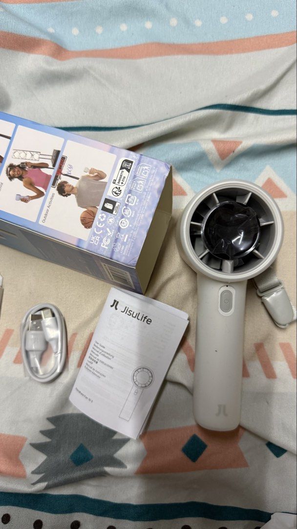 Jisulife 10s Handheld Fan (Category: Fans) located in Makati City. Submitted by zari0829 (Listing ID 1463004850, Image 1). Description: - Portable Jisulife handheld fan - Includes lanyard for easy carrying - Comes with USB charging cable - Multiple speed settings - Box and manual included - Works well, keeps you cool on the go -Never used, opened and tested only -With free silicone cover already.