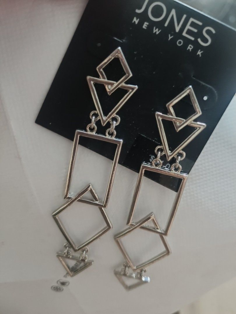 Jones New York Silver Geometric Dangle Earrings (Category: Earrings) located in Bacolod City. Submitted by jewels.of.joy (Listing ID 1463004724, Image 3). Description: - Brand: Jones New York - Style: Silver Dangle Earrings - Design: Modern geometric shapes (squares, diamonds, triangles) - Length: Long drop style - Perfect for: Adding a modern touch to any outfit - Condition: Comes on original backing card.