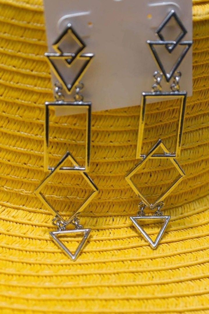 Jones New York Silver Geometric Dangle Earrings (Category: Earrings) located in Bacolod City. Submitted by jewels.of.joy (Listing ID 1463004724, Image 2). Description: - Brand: Jones New York - Style: Silver Dangle Earrings - Design: Modern geometric shapes (squares, diamonds, triangles) - Length: Long drop style - Perfect for: Adding a modern touch to any outfit - Condition: Comes on original backing card.