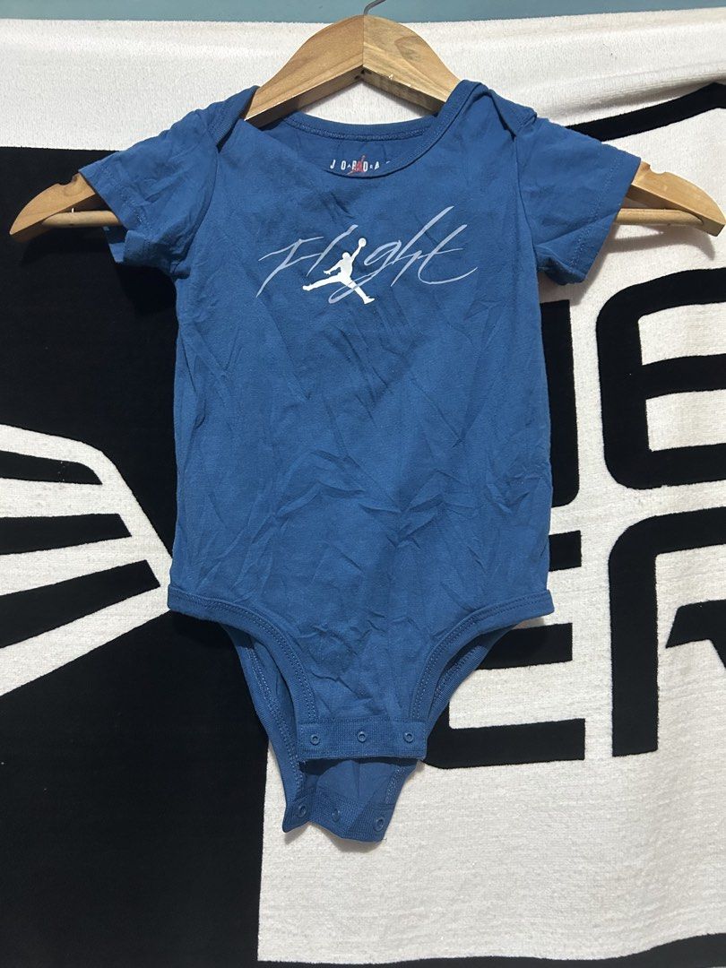 Jordan Flight Baby Onesie Blue 12M (Category: Babies & Kids Fashion) located in Barotac Nuevo. Submitted by ehsherjohn27 (Listing ID 1462906861, Image 1). Description: - Blue Jordan onesie with flight logo - Short sleeves - Snap closure at the bottom - Made from a cotton and polyester blend - Size: 12 months - Perfect for your little baller!.