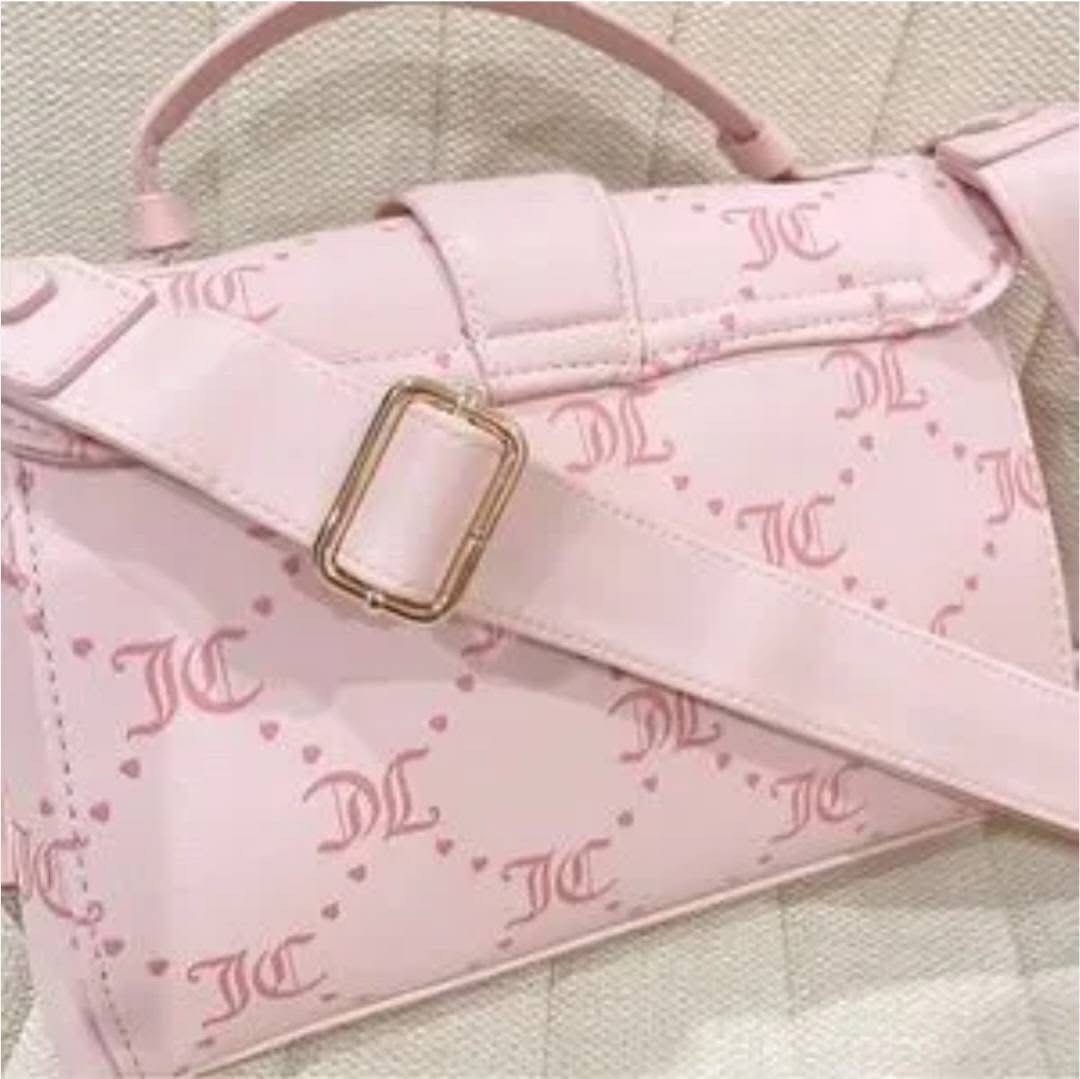 Juicy Couture Blush Pink Sling Bag (Category: Cross-body Bags) located in Muntinlupa City. Submitted by pink_strawberry_collections (Listing ID 1463001412, Image 2). Description: Juicy Couture Pink Slingbag (Brand New) Has sling. Bought in the US. 💯 Original Color may slightly vary due to lighting. Payment first policy. All sales are final. No return, no exchange. Shipping fee will be shouldered by the buyer..
