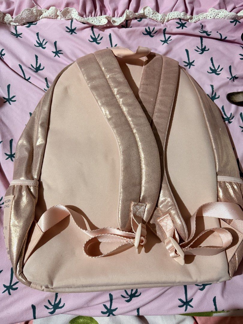 Justice Rose Gold Glitter Unicorn Backpack (Category: Babies & Kids Fashion) located in Cabanatuan. Submitted by styled.shoppe (Listing ID 1463046329, Image 2). Description: - Adorable rose gold backpack from Justice. - Features a sparkly unicorn horn and ears. - Glitter letter 'A' on the front pocket. - Stylish quilted design all over. - Ideal for school or everyday adventures. - Zippers are in excellent working condition. - Adjustable straps fo