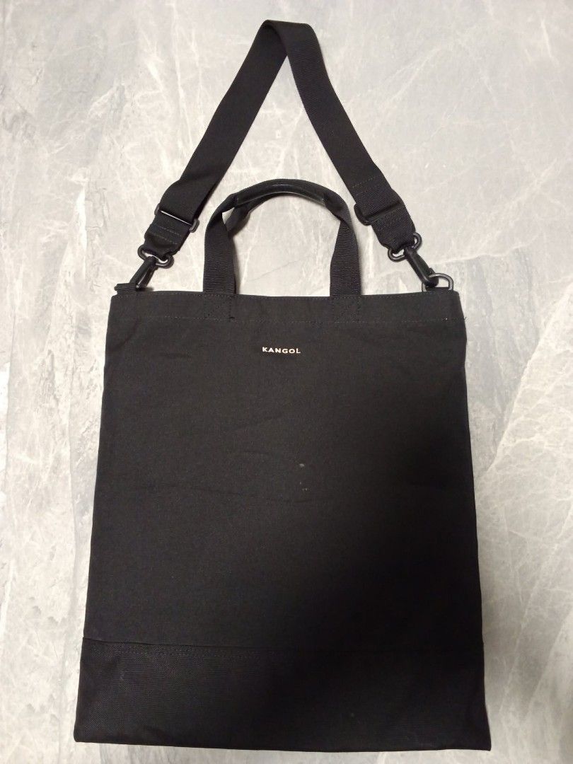 Kangol Black Canvas Tote Bag with Shoulder Strap (Category: Tote Bags) located in Manila. Submitted by cosmiccloud-9236 (Listing ID 1462940420, Image 2). Description: - Brand: Kangol - Color: Black - Material: Canvas - Features: Top handles, adjustable shoulder strap - Design: Simple with Kangol logo - Use: Ideal for everyday carry - Capacity: Spacious interior - Portability: Easy to carry.