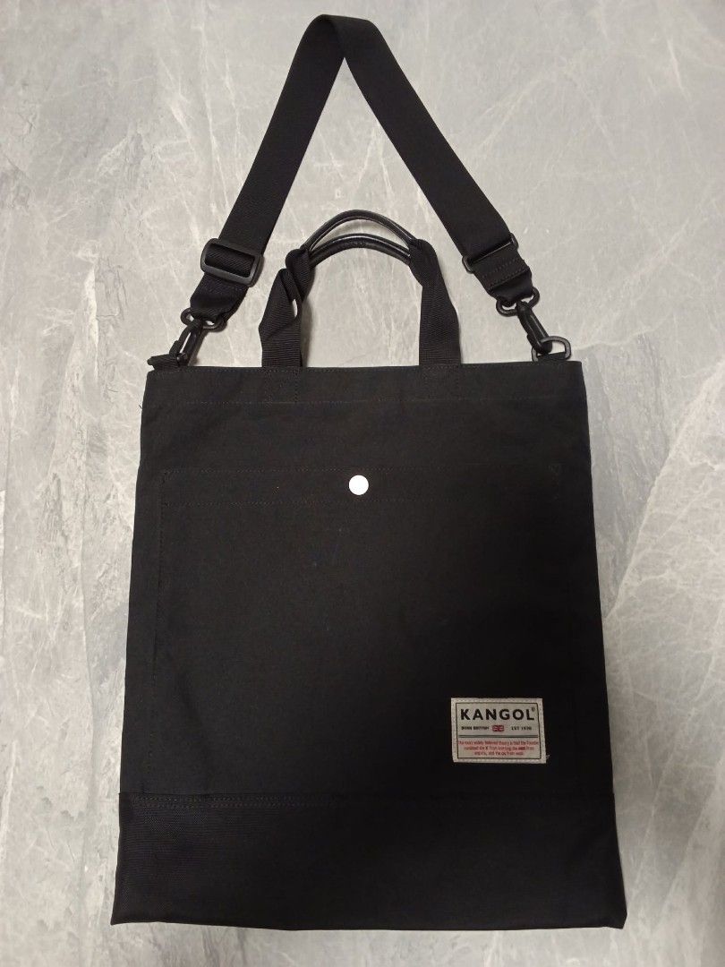 Kangol Black Canvas Tote Bag with Shoulder Strap (Category: Tote Bags) located in Manila. Submitted by cosmiccloud-9236 (Listing ID 1462940420, Image 1). Description: - Brand: Kangol - Color: Black - Material: Canvas - Features: Top handles, adjustable shoulder strap - Design: Simple with Kangol logo - Use: Ideal for everyday carry - Capacity: Spacious interior - Portability: Easy to carry.