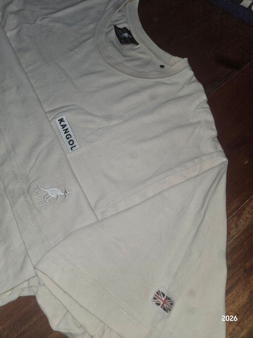 Kangol Size XL (Dark Spots are from CAMERA) (Category: Tshirts & Polo Shirts ) located in Bislig. Submitted by edisontv (Listing ID 1463009526, Image 1). Description: - FREE SHIPPING FEE - OPEN FOR VIDEO CALL - Light Cream colored long sleeve t-shirt - Brand: Kangol - Features Kangol logo on chest - Small Union Jack flag detail on sleeve - Size: XL - Condition: Minor faint marks (please check photos for details).