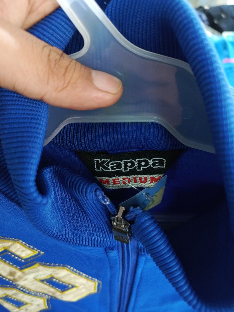 Kappa Argentina '66 Track Jacket Blue Medium (Category: Coats, Jackets and Outerwear) located in Cabatuan. Submitted by penthegreat (Listing ID 1463112358, Image 3). Description: - Blue Kappa track jacket - Features Argentina '66 graphic - Full zip front with pockets - Ribbed collar, cuffs, and hem - Made of 100% cotton - Tagged as Medium - Ideal for casual wear or sports.