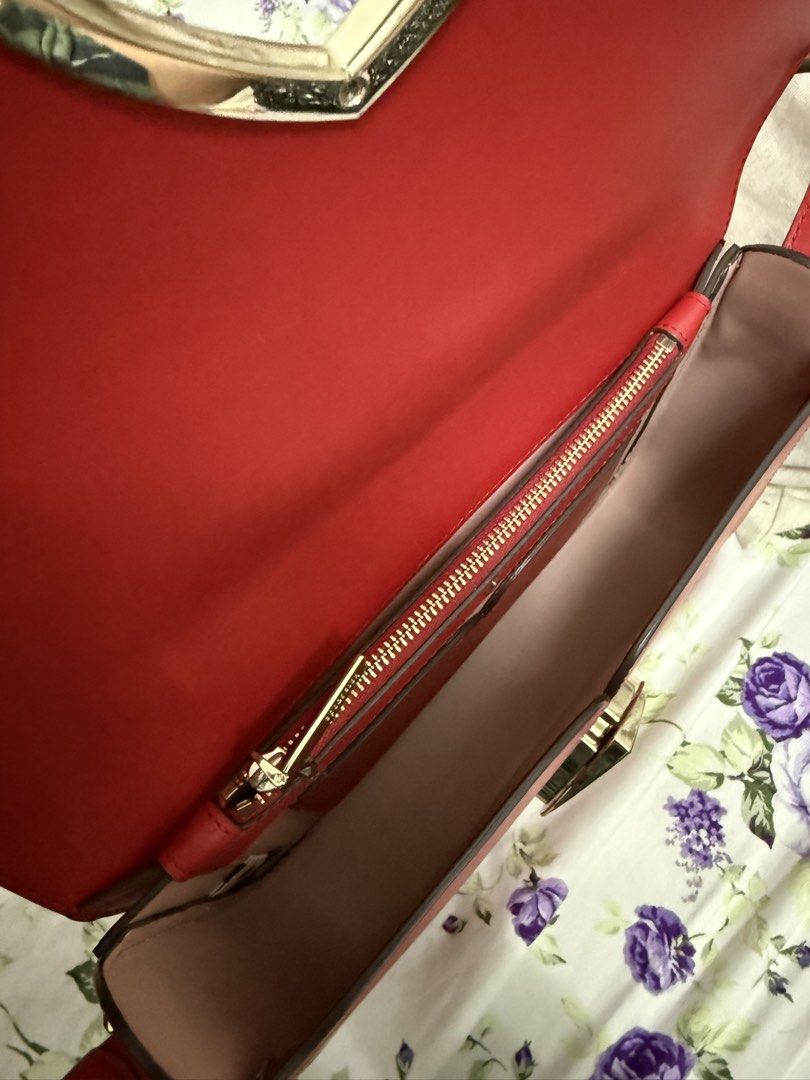 Kate Spade Red Spade Heart Shoulder Bag (Category: Luxury Bags & Wallets) located in Navotas City. Submitted by lourvecamille (Listing ID 1462953628, Image 3). Description: - Authentic red nicola Kate Spade shoulder bag - Signature spade logo with a charming pink heart detail (Twistlock) - Elegant gold hardware - Convenient interior zip pocket - Adjustable strap for customized fit - Ideal for everyday errands or a stylish night out.