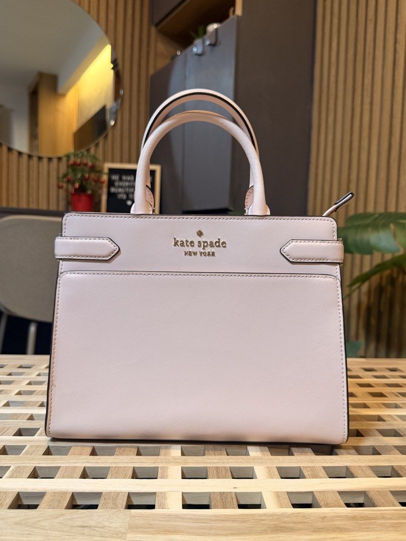Kate Spade Staci medium satchel (Category: Tote Bags) located in Pasig City. Submitted by mandks (Listing ID 1462886991, Image 1). Description: SALE: ₱3,500 + sf only 🔥 Kate Spade Staci medium satchel 9.5/10 - my personal favoriiiite 🩷🩷🩷 See last photo for a very minor flaw Exterior slip pockets Interior zip and slip pockets Comes with an adjustable strap See last 2 photos for size reference Very makiniiiis!! 🥹 ₱3,700 + shipping fee (J&T/Lal