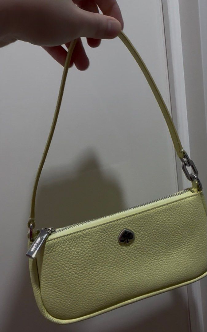 Kate Spade Yellow Leather Shoulder Bag (Category: Luxury Bags & Wallets) located in Manila. Submitted by mariii10 (Listing ID 1463014810, Image 2). Description: - Cute yellow shoulder bag from Kate Spade - Made of genuine leather - Secure zip closure - Stylish silver hardware details - Small and compact, ideal for carrying essentials - Adds a perfect pop of color to any outfit.
