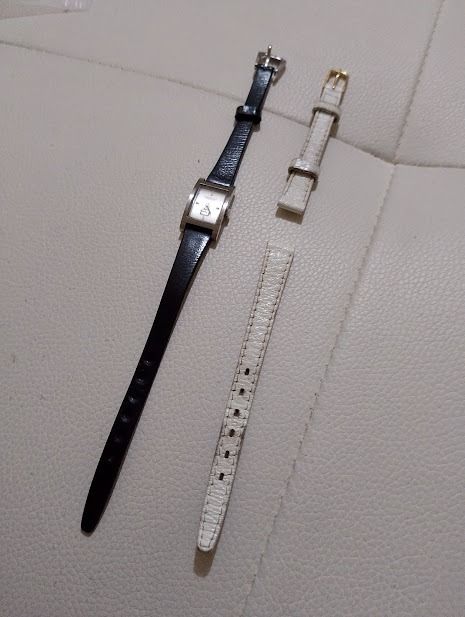 Kenneth Cole New York Rectangular Watch with Extra Straps (Category: Women's Watches) located in Quezon City. Submitted by susmaryosep1 (Listing ID 1463010849, Image 2). Description: - Kenneth Cole New York watch - Rectangular face - Black leather strap included - Two additional white leather straps - Simple and classic design - Ideal for everyday wear 2k.