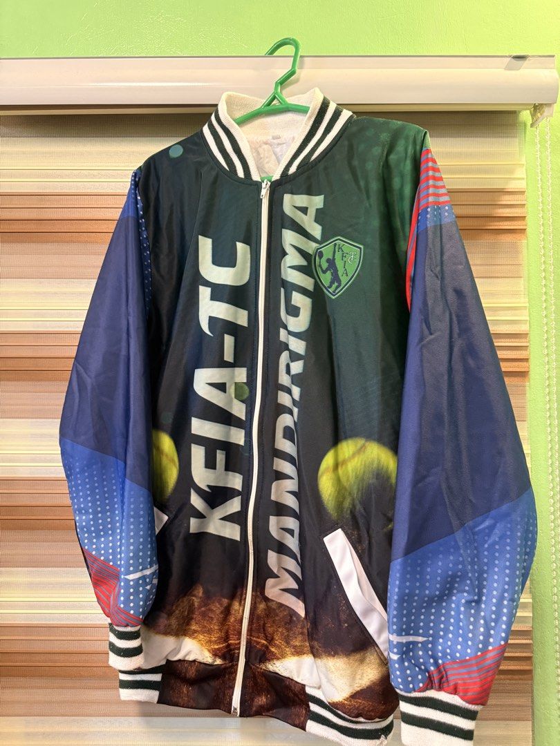 KFIA-TC MANDIRIGMA Bomber Jacket (Category: Coats, Jackets and Outerwear) located in Caloocan City. Submitted by johnpaulj (Listing ID 1462922560, Image 1). Description: SIZES A = 28 Inches B= 20 Inches - Cool KFIA-TC MANDIRIGMA bomber jacket - Unique graphic print on front and back - Back features quote: 'IT NEVER GETS EASIER, YOU JUST GET BETTER.' - Ribbed collar, cuffs, and hem - Zipper closure - Perfect statement piece.
