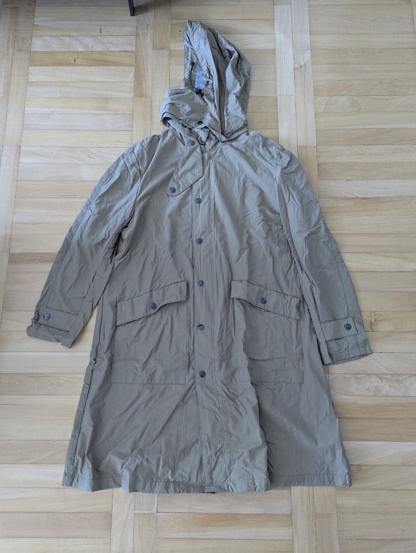 Khaki Hooded Trench Coat Size M (Category: Coats, Jackets and Outerwear) located in Taguig. Submitted by hlco13 (Listing ID 1462960807, Image 1). Description: - Khaki hooded trench coat - Size M - Button-up front with zip closure underneath - Two front pockets with button closures - Adjustable drawstring at the hood - Back vent for ease of movement - Ideal for rainy days.