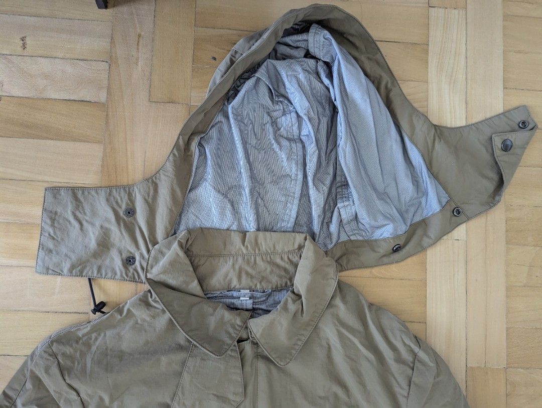 Khaki Hooded Trench Coat Size M (Category: Coats, Jackets and Outerwear) located in Taguig. Submitted by hlco13 (Listing ID 1462960807, Image 2). Description: - Khaki hooded trench coat - Size M - Button-up front with zip closure underneath - Two front pockets with button closures - Adjustable drawstring at the hood - Back vent for ease of movement - Ideal for rainy days.
