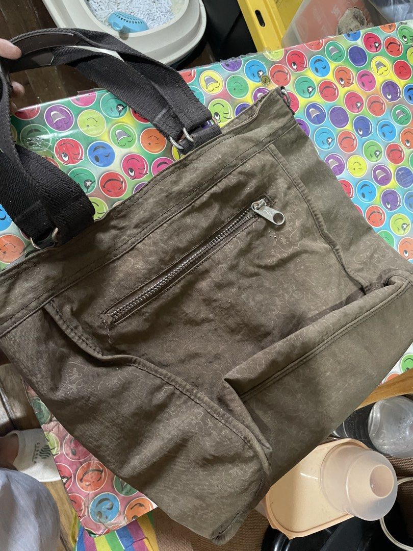 Kipling Tote Bag (Category: Tote Bags) located in Quezon City. Submitted by garagesaleonline (Listing ID 1462892056, Image 2). Description: - Brown Kipling tote bag - Front zipper pocket - Two top handles - Multiple interior pockets, including a zippered one - Ideal for everyday use - Spacious enough for essentials.