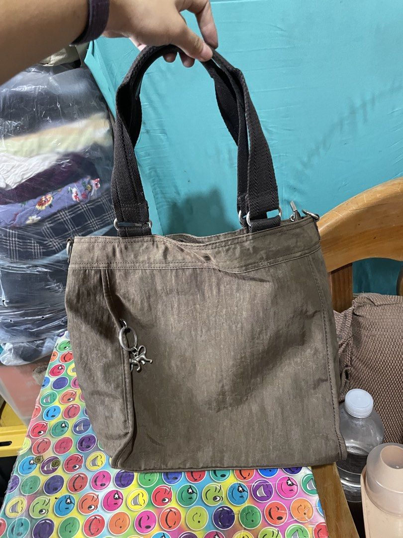 Kipling Tote Bag (Category: Tote Bags) located in Quezon City. Submitted by garagesaleonline (Listing ID 1462892056, Image 1). Description: - Brown Kipling tote bag - Front zipper pocket - Two top handles - Multiple interior pockets, including a zippered one - Ideal for everyday use - Spacious enough for essentials.