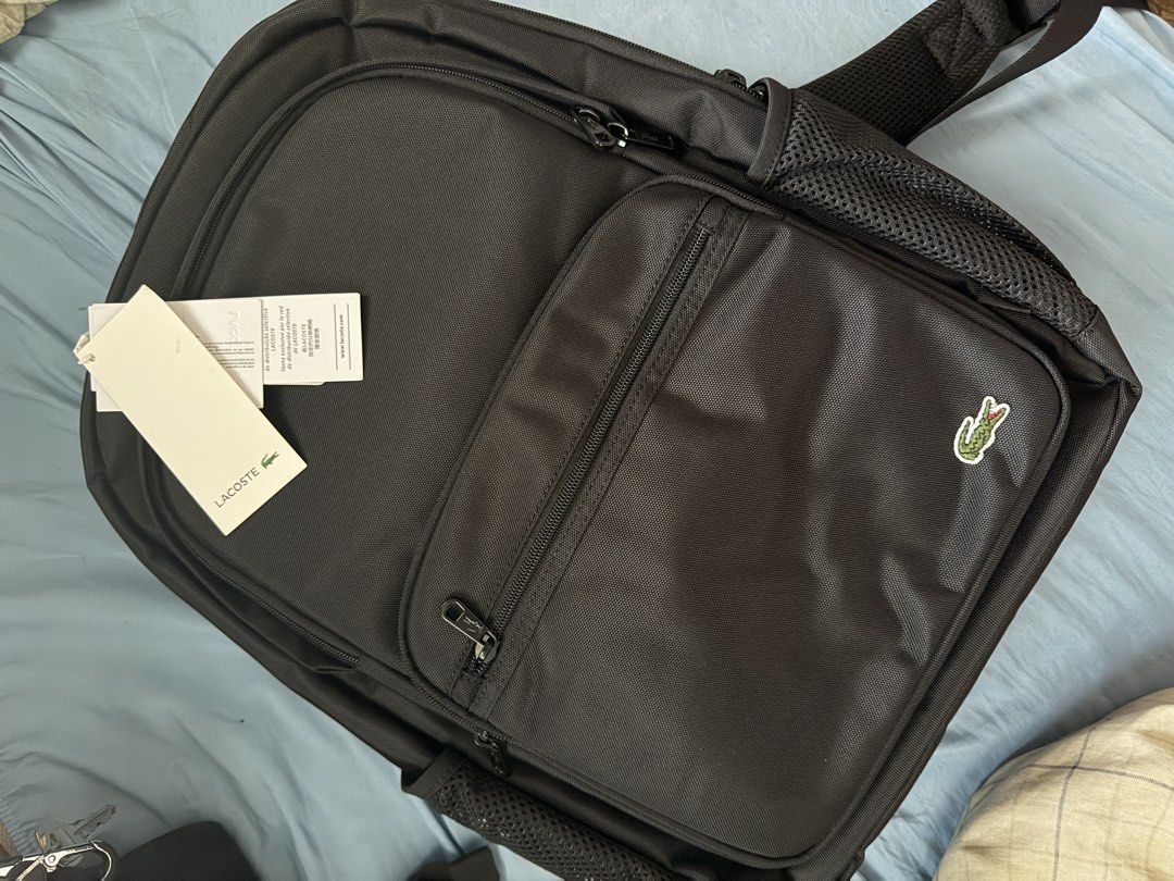Lacoste Backpack with laptop compartment (Category: Backpacks) located in Manila. Submitted by hammiedos (Listing ID 1462802505, Image 1). Description: - Lacoste backpack with tag plastic and paper bag - Signature crocodile logo on the front - Multiple interior pockets - Side mesh compartments for water bottles or essentials - Sturdy zippers for durability - Brand new with original tags attached - Ideal for school, work, or everyday adventures Se