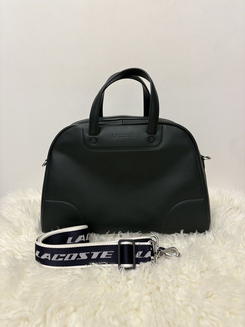 Lacoste Black Duffel Bag with Strap (Category: Sling Bags) located in Quezon City. Submitted by AAAAAF14 (Listing ID 1463082148, Image 1). Description: Used once then stored. bought for 20k selling low already. fixed price will keep than sell low - Authentic Black Lacoste duffel bag - Ideal for weekend trips or gym use - Spacious interior for all your essentials - Comes with a detachable strap featuring the Lacoste logo - Clean and simple, versat
