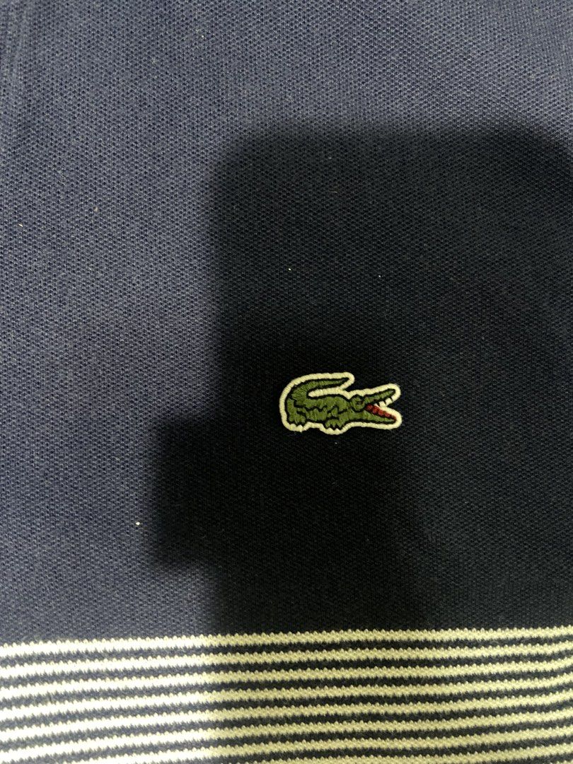 Lacoste Polo shirt (Category: Activewear) located in Tuguegarao City. Submitted by nero_28 (Listing ID 1462902964, Image 2). Description: Issue discoloration Dimes 26/19 .