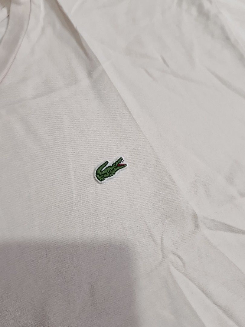 LACOSTE TSHIRT (Freeshipping) (Category: Shirts) located in Quezon City. Submitted by gyl-stop (Listing ID 1463019926, Image 3). Description: free shipping 22 x 24.5 very good condi cr: 9.5/10 issue: minor pink discoloration sa may Balikat and likod.
