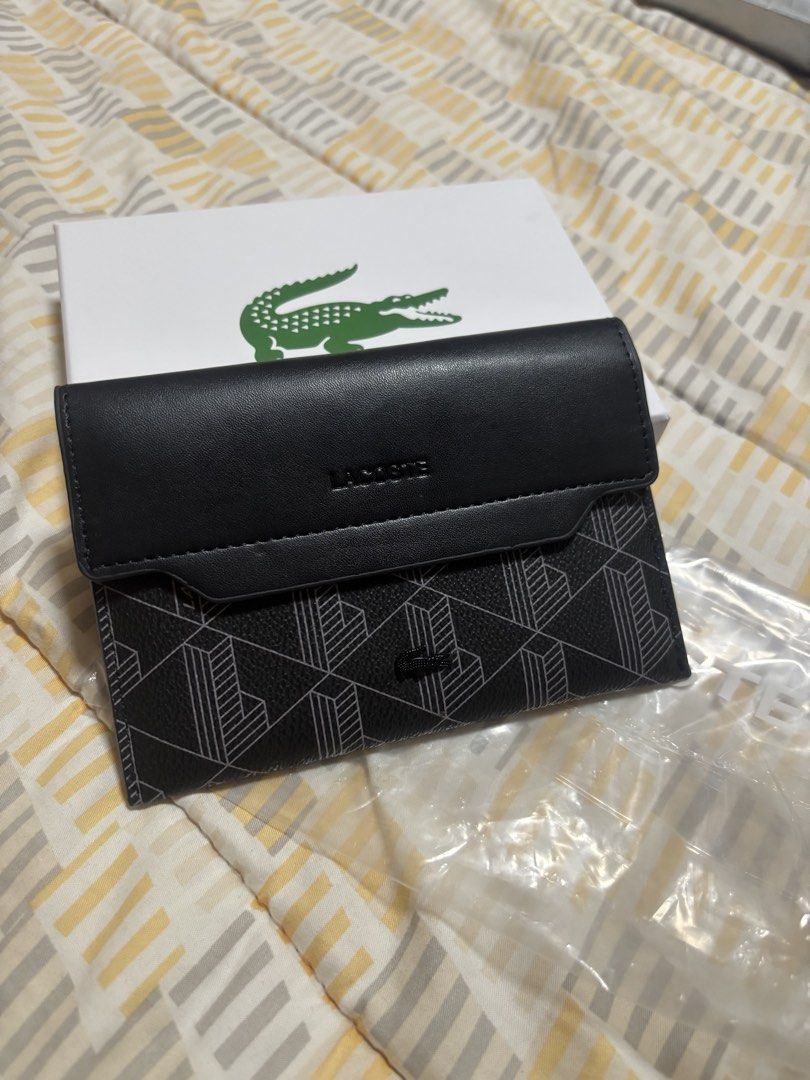 Lacoste Wallet Black Monogram (Category: Wallets & Card Holders) located in Balanga. Submitted by letjavate (Listing ID 1463018721, Image 1). Description: - Authentic Black Lacoste Wallet - Features a stylish geometric monogram pattern - Secure snap closure - Multiple interior card slots for organization - Comes with its original box - Ideal for keeping your daily essentials tidy and accessible.
