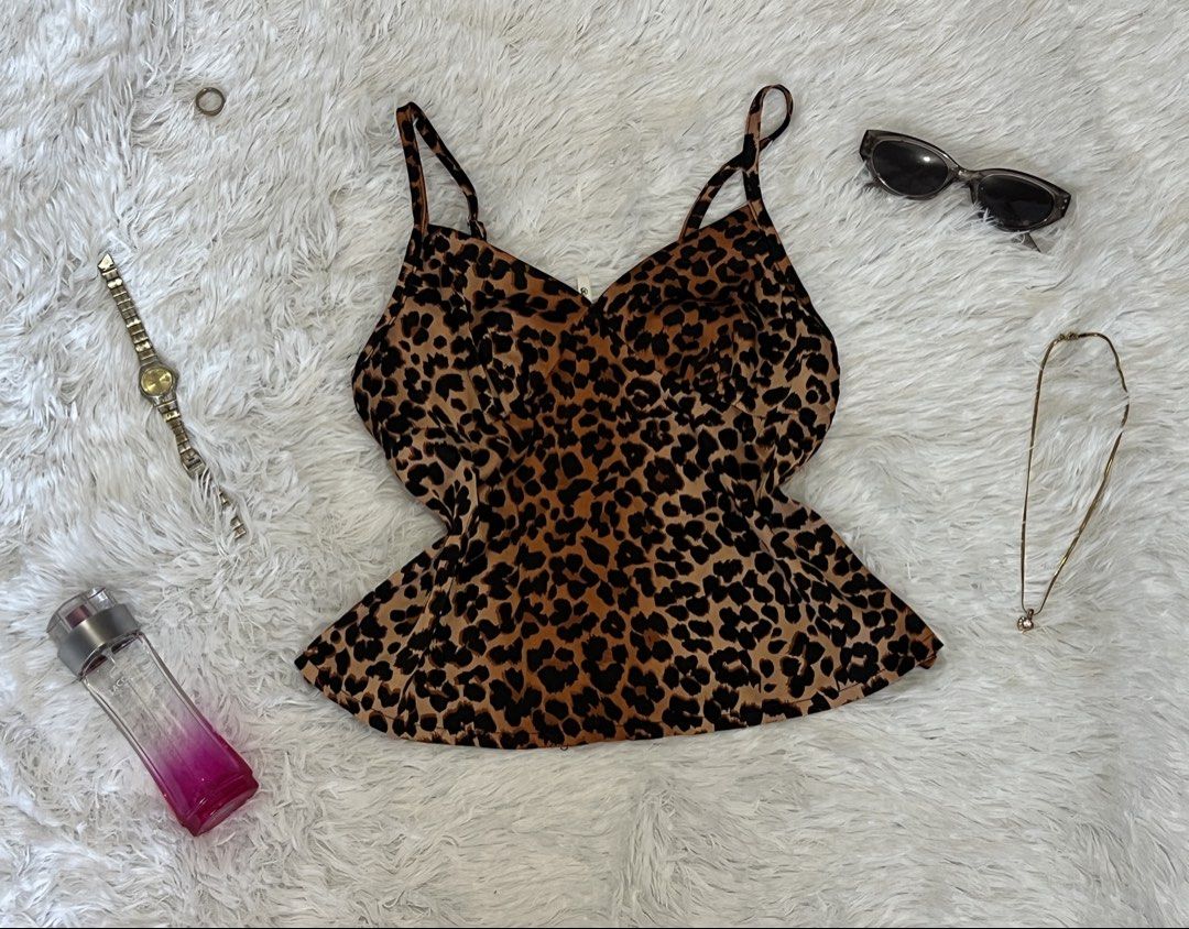 Leopard Print Camisole Top (Category: Sleeveless) located in Tuguegarao City. Submitted by love_clothies (Listing ID 1462897362, Image 1). Description: - Cute leopard print camisole - Features spaghetti straps - Flattering V-neckline - Ideal for layering or wearing on its own - Pairs well with jeans or skirts - Adds a touch of wild style to your look.