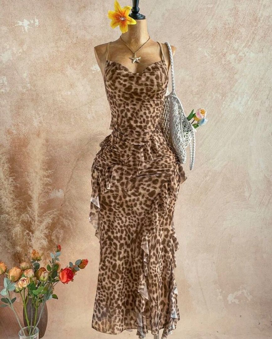 Leopard Print Spaghetti Strap Midi Dress (Category: Dresses) located in Calapan. Submitted by mantalarhi10463 (Listing ID 1463046897, Image 1). Description: Gorgeous leopard print midi dress with adjustable spaghetti straps and a flattering, feminine fit. Perfect for dates, vacations, beach trips, or casual dressy occasions. Condition: Like New — worn only once My Height: 5’3” Weight: 58 kg Bust: 34” Waist: 27” Reference: Worn with flat clogs Str