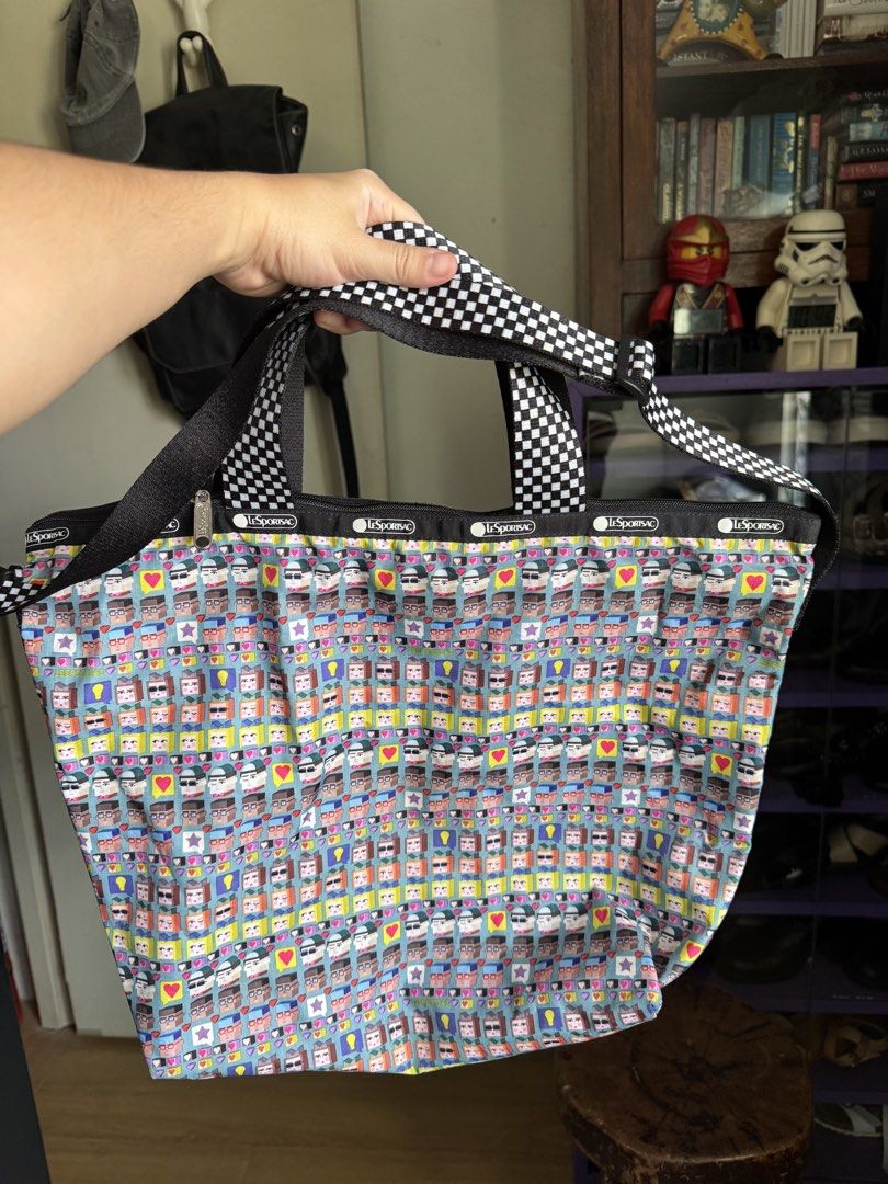LeSportsac Tote Bag (Category: Tote Bags) located in Mabalacat. Submitted by darkmochafrappe2 (Listing ID 1462903256, Image 1). Description: - Used once the stored - Fun pixelated faces and hearts print - Black and white checkered straps - Zipper closure - Ideal for everyday use or travel - Plenty of interior space.