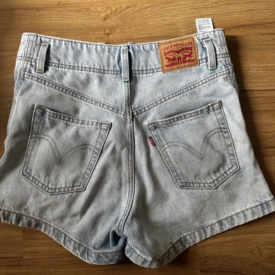 Levis High Waisted Mom Shorts (Category: Shorts) located in Pasig City. Submitted by funkypeach (Listing ID 1462898113, Image 1). Description: Authentic Levi’s High Waisted Mom Shorts. Size 26. Cute, light, denim color. In perfect condition. Used lightly. RFS Decluttering MOP Gcash Buyer shoulders shipping .