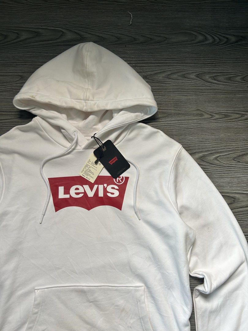 Levi's White Hoodie with Red Logo (Category: Hoodies) located in Dasmarinas. Submitted by zn_upcldtrs (Listing ID 1462996261, Image 2). Description: LEVIS DEAD-STOCK HOODIE - 22 W / 28 L - EXCELLENT CONDITION - STAINS .