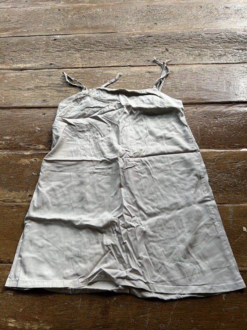 Light Grey Slip Dress with Adjustable Straps (Category: Dresses) located in Surigao. Submitted by chastnavarrete (Listing ID 1463035975, Image 1). Description: - Light grey slip dress - Adjustable tie straps - Comfortable fabric with a nice drape - Versatile for layering or wearing on its own - Straight hemline - Ideal for casual wear.