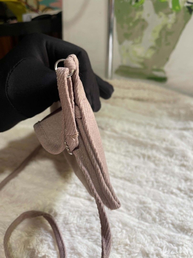 Light Pink Textured Crossbody Bag with Adjustable Strap (Category: Cross-body Bags) located in Naawan. Submitted by twilly.apparel2 (Listing ID 1462956805, Image 3). Description: - Cute textured crossbody bag - Light pink/mauve shade - Long adjustable strap - Interior pockets for organization - Fits phone easily - Ideal for daily necessities - Simple and practical design.